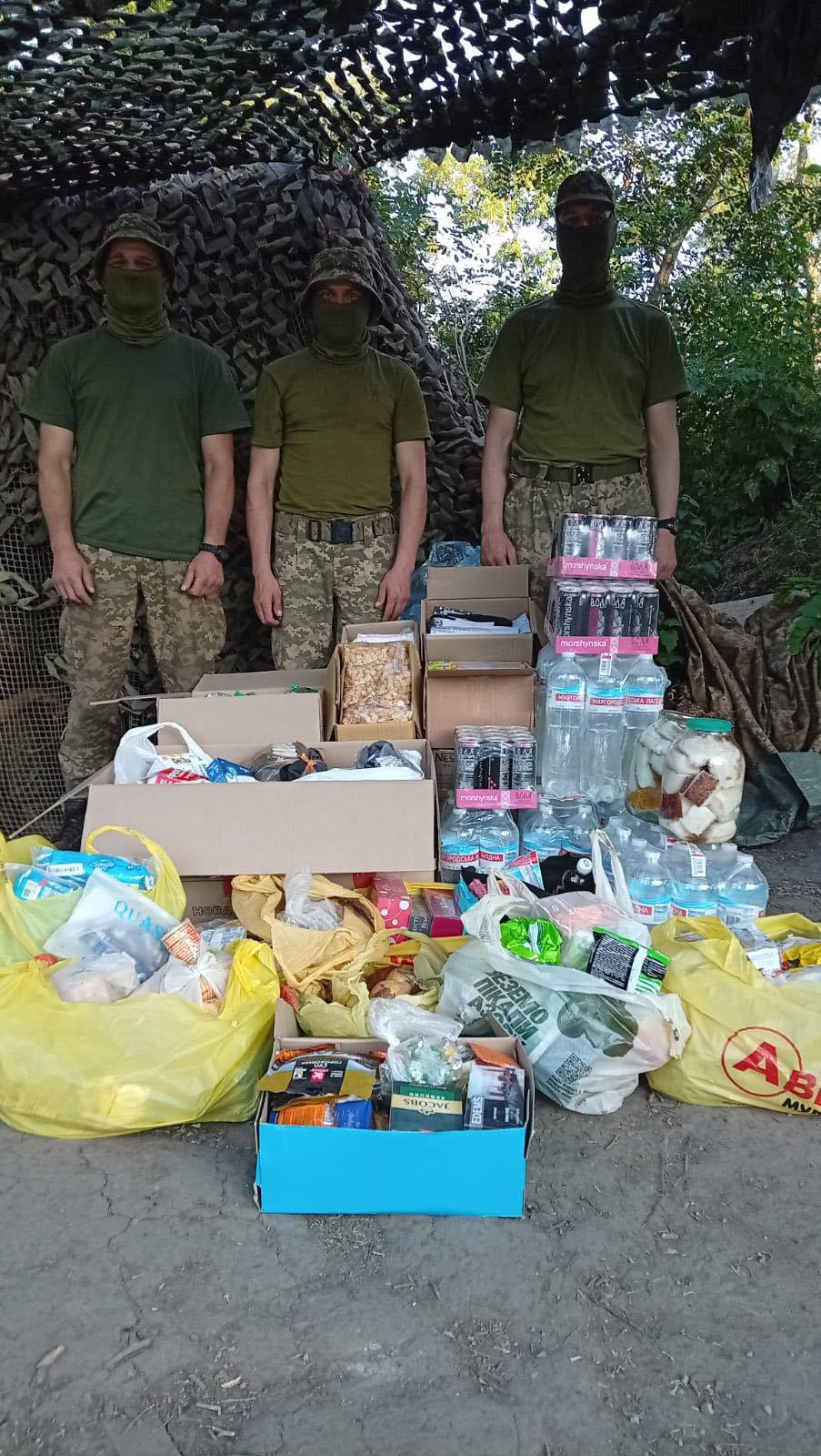 Ukrainian defenders with the humanitarian aid they received