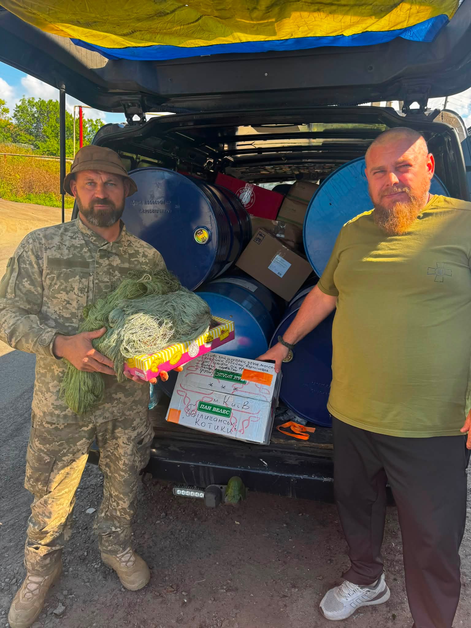 Defenders with camouflage supplies and humanitarian aid they received